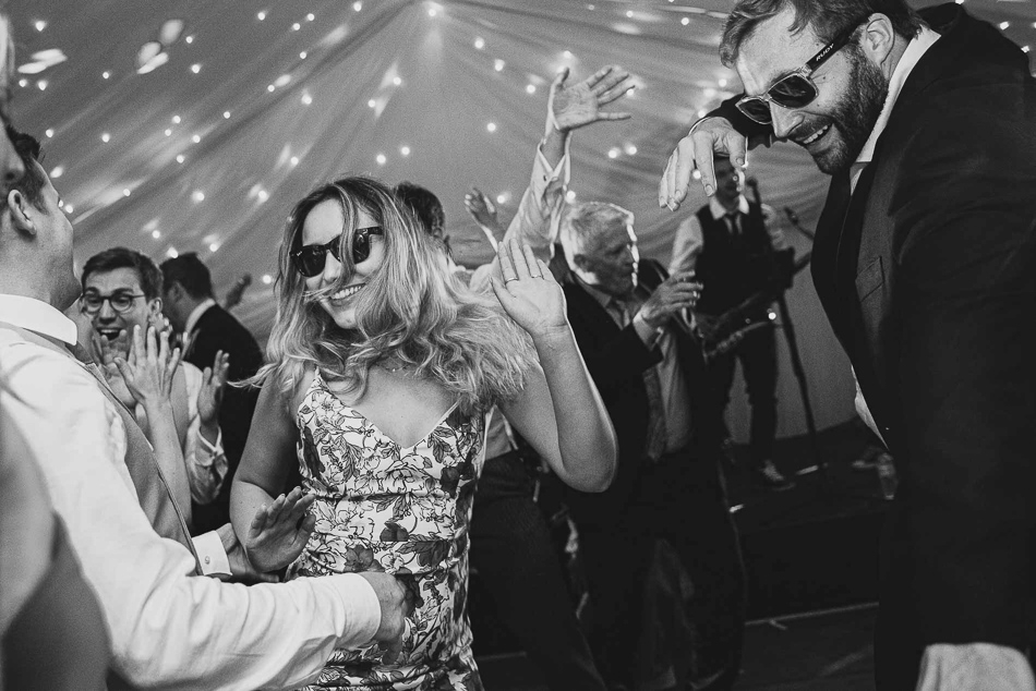 Jersey wedding photography. Guests dancing at a wedding in Jersey, Channel Islands