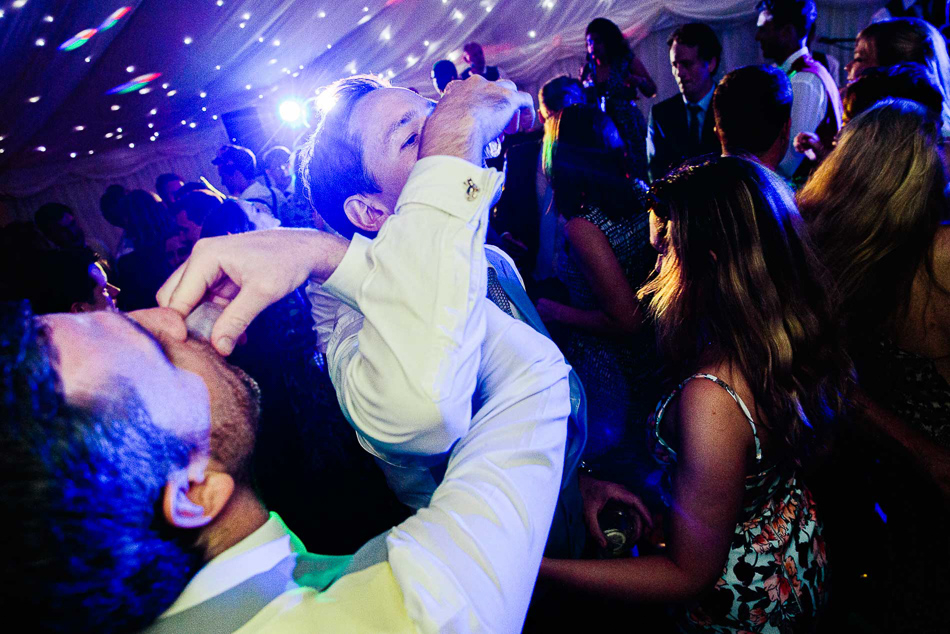 Guests dancing and drinking at a wedding in Jersey, Channel Islands