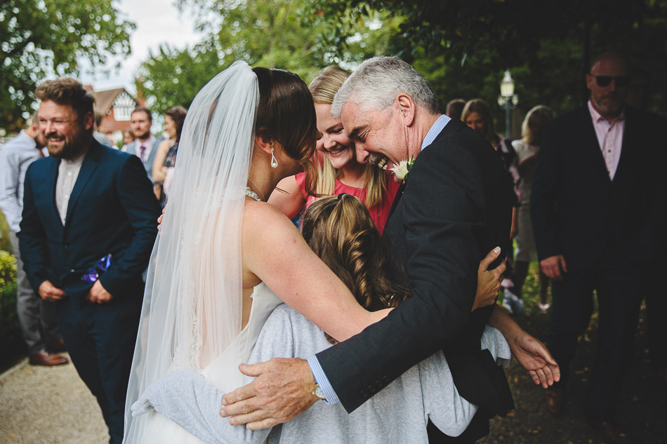 Wedding guests embrace