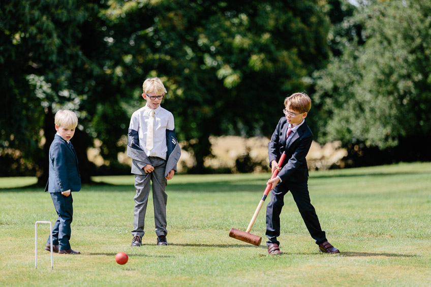 Kids playing croquet