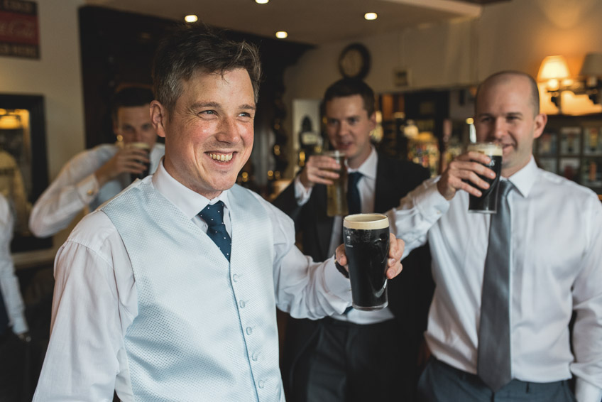 Groom having a pint