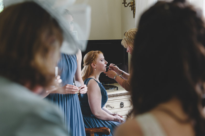 bridesmaid having make-up done