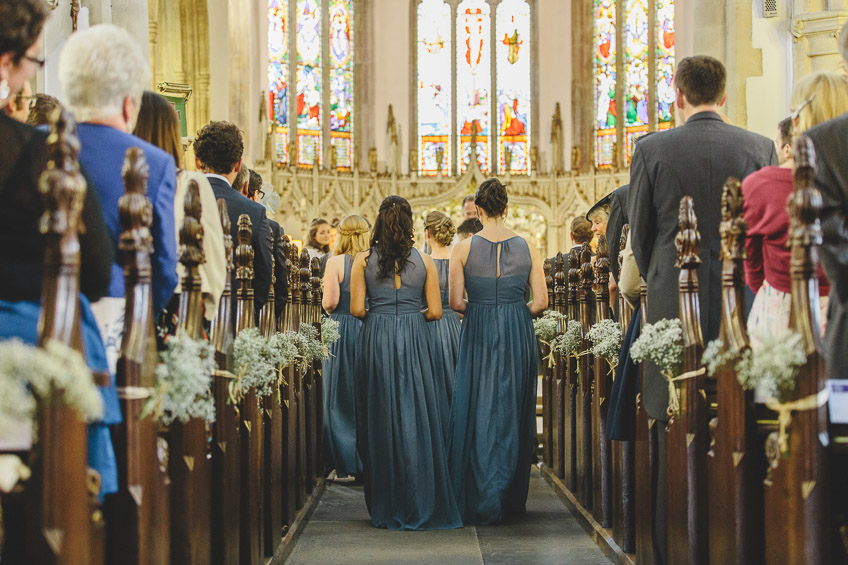 bridesmaids walking up aisle