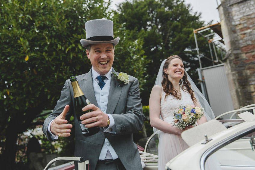 groom celebrating with champagne