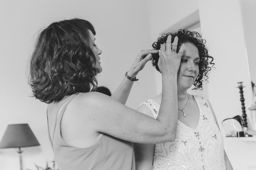 Bride having her hair clip put in place